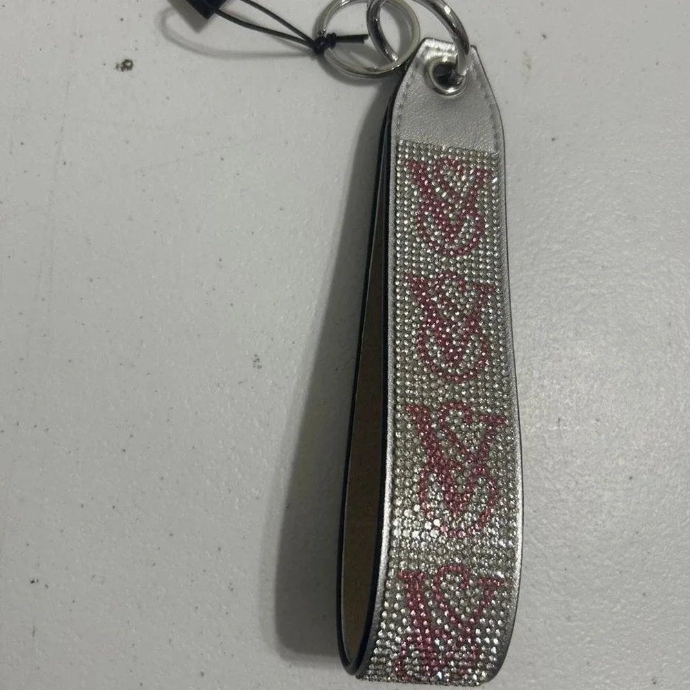 Victoria's Secret pink & silver rhinestone keychain with repeating V-shaped